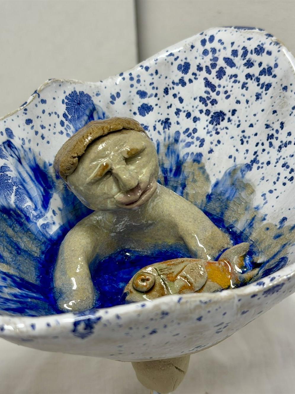 Schwimmwer mit Fisch